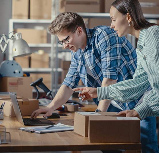 Small business owners looking at their laptop.