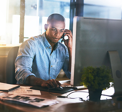 Business person in front of their computer.