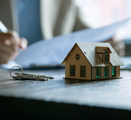 Keys and a small house.