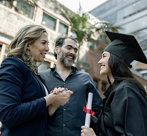 College graduate with her parents.